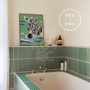 May include: A bathroom with green and white striped tile, a white bathtub, and a framed painting of a zebra. The painting is above a shelf with bottles of toiletries.