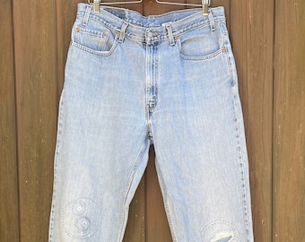 Waist 36 measured. Vintage 90s LEVI'S 550 Relaxed Fit Faded Light Wash Jeans. Patched|Mended. 38x32.