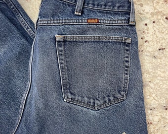 Vintage 80s Rustler by Wrangler jeans.  Straight leg.  Mildly distressed.  Tag 38 x 30.  Actual 36 x 29.