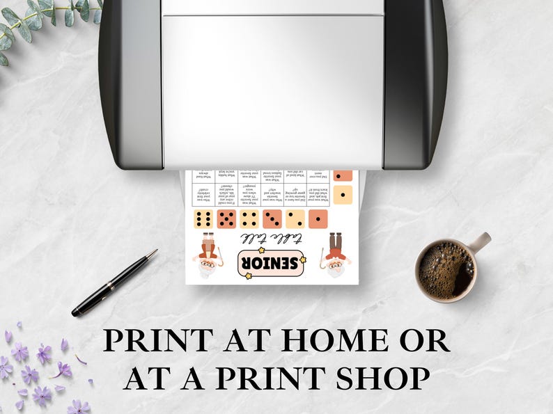 May include: A printed game sheet with dice illustrations and the words "Table Talk Senior" is shown emerging from a printer. A pen and a cup of coffee are on the table. The text "PRINT AT HOME OR AT A PRINT SHOP" is at the bottom.