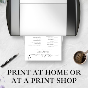 May include: A black and white printed game sheet is coming out of a printer. The sheet has the words "MATCH UP" and "black to mom" in cursive. A pen and a cup of coffee are on the table. The text "PRINT AT HOME OR AT A PRINT SHOP" is at the bottom.