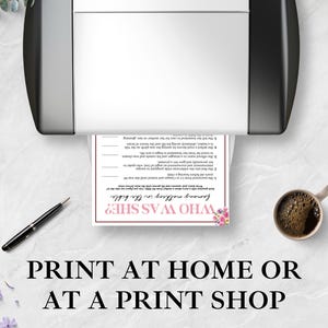 May include: A printer is shown with a printed sheet of paper that says "WHO WAS SHE?" with floral accents. A pen and a cup of coffee are next to the printer. The text "PRINT AT HOME OR AT A PRINT SHOP" is at the bottom.