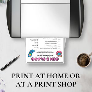May include: A printed Gen Z slang match-up game sheet is shown emerging from a printer. A pen and a cup of coffee are on the table. The text at the bottom reads "PRINT AT HOME OR AT A PRINT SHOP."