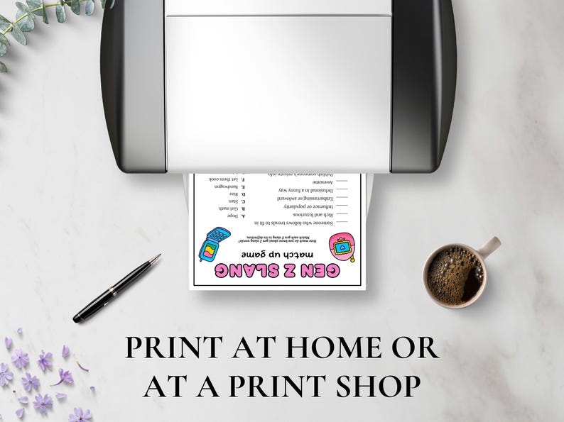May include: A printed Gen Z slang match-up game sheet is shown emerging from a printer. A pen and a cup of coffee are on the table. The text at the bottom reads "PRINT AT HOME OR AT A PRINT SHOP."