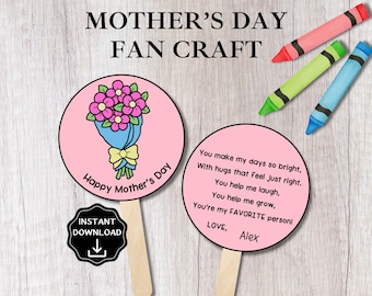 May include: A Mother's Day fan craft with a pink circular design. One fan features a bouquet of flowers, and the other has a poem. The text "Happy Mother's Day" is on one fan. The image also includes three crayons.