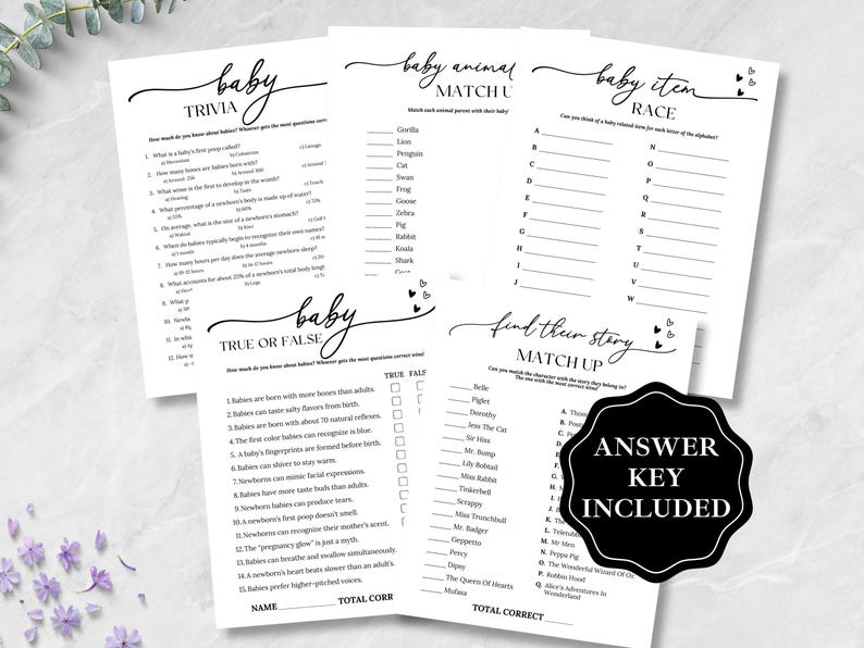 May include: A collection of white baby shower game sheets with black text, including trivia, match-up, and true or false games. A black and white "Answer Key Included" sticker is also present. The games are decorated with small heart graphics.