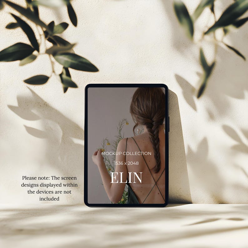May include: A black tablet with a screen displaying a woman with a braid holding flowers. The screen also shows the text "MOCKUP COLLECTION 1536 x 2048 ELIN". Olive branches cast shadows on the beige background. The text "Please note: The screen designs displayed within the devices are not included" is also visible.