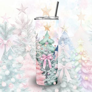 May include: A stainless steel tumbler with a white background and a watercolour design of Christmas trees with pink and green baubles. The tumbler has a straw.
