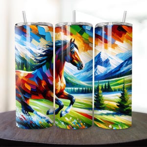 May include: Three stainless steel tumblers with a colorful abstract painting of a horse running through a mountain landscape. The horse is painted in shades of brown, red, blue, green, and yellow. The mountains are painted in shades of blue and white. The background is painted in shades of green and yellow.