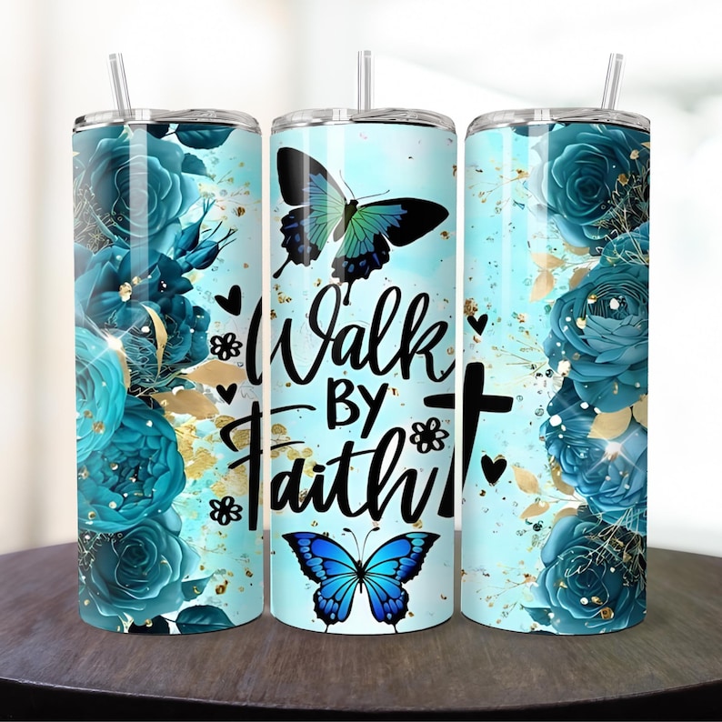 May include: Three stainless steel tumblers with a blue and gold floral design and butterflies. The tumblers have a white background and the text "Walk by Faith" in black lettering.