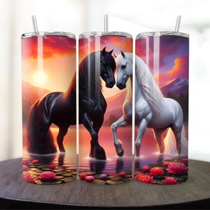 May include: Two horses, one black and one white, stand in a lake at sunset. The water reflects the colors of the sky, creating a beautiful scene. The horses are facing each other, and their manes and tails flow in the breeze.