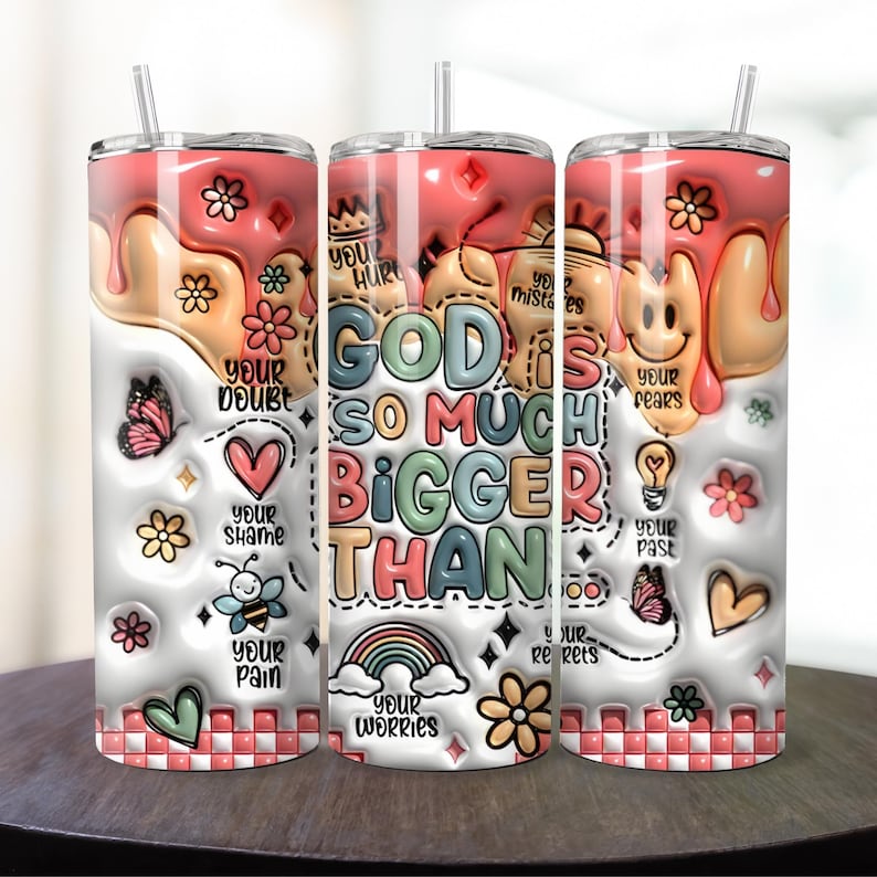 May include: A white tumbler with a pink, white, and yellow dripping design. The tumbler has a colorful graphic that says "God is so much bigger than your doubt, your hurt, your shame, your pain, your worries, your mistakes, your fears, your regrets, your past".