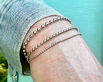 Stainless Steel Ball Chain Bracelet with Lobster Clasp. In Three Sizes, 1.5mm, 2.4mm, and 3.2mm. Custom Length & Adjustability Options.