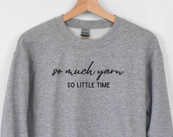 May include: Gray sweatshirt with the text "so much yarn so little time" in black.