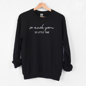 May include: Black sweatshirt with white text that reads "so much yarn so little time".