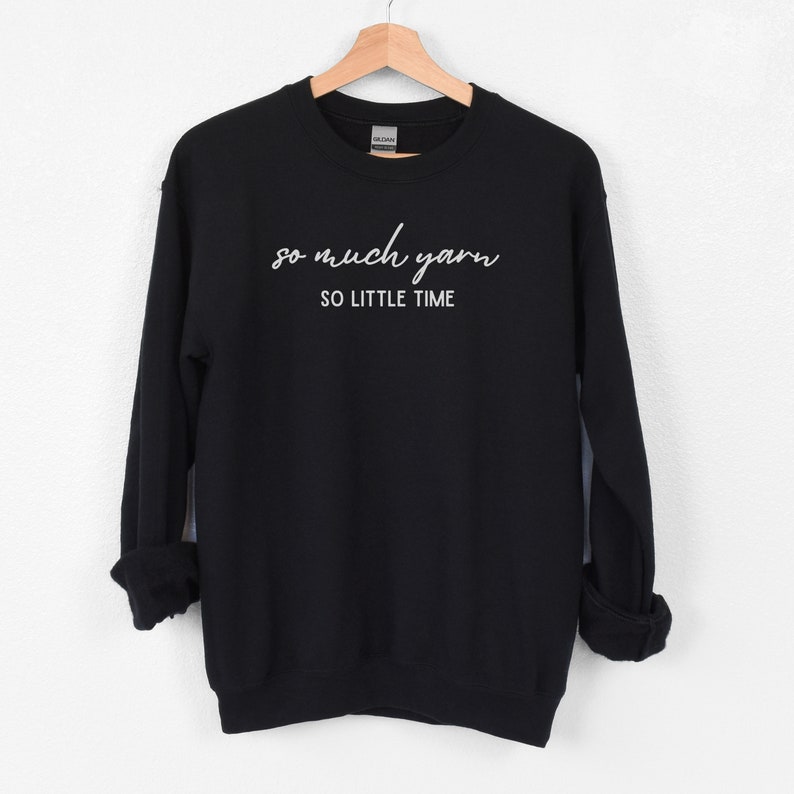 May include: Black sweatshirt with white text that reads "so much yarn so little time".