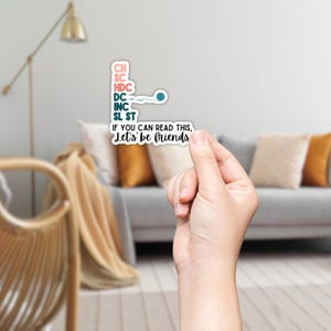 May include: A white sticker with text and a teal and pink color scheme. The sticker reads "CH, SC, HDC, DC, INC, SL ST" and "IF YOU CAN READ THIS, Let's be friends."