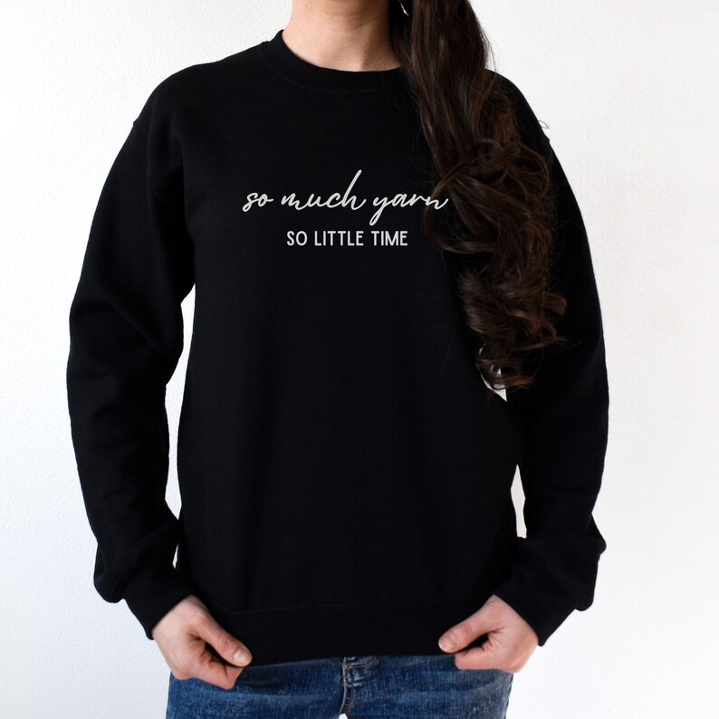 May include: Black sweatshirt with white text that reads "so much yarn so little time".