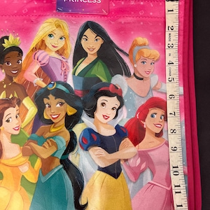 May include: A white ceramic mug with a black handle and the text "But First, Coffee" in a bold, black font. The mug is sitting on a wooden surface. The mug is approximately 4 inches tall.