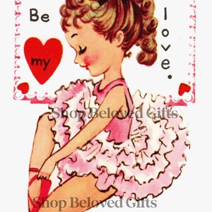 May include: Vintage Valentine's Day card featuring a young girl in a pink tutu and red ballet shoes. The card includes the text "Be my love" and heart accents, with "Shop Beloved Gifts" text.