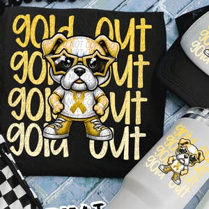May include: Black t-shirt, hat, and white tumbler featuring a cartoon bulldog wearing sunglasses and yellow sneakers. The shirt has the words "Gold Out" and the bulldog graphic. The tumbler and hat also have the bulldog graphic.