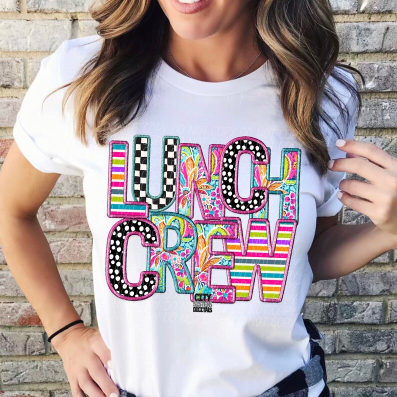 May include: White t-shirt with a colorful "Lunch Crew" graphic. The letters are made up of different patterns, including polka dots, stripes, and floral designs.