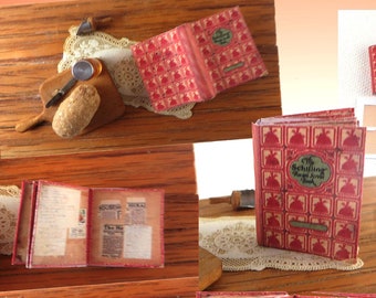 May include: A digital printable project for a 1:12 scale recipe scrap book junk journal. The image shows a collage of different pages and covers for the journal, including a red cover with a floral pattern, a page with handwritten recipes, and a page with a newspaper clipping. The text "NOTES" is visible on one of the pages.