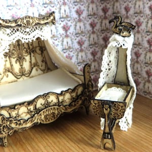 May include: A miniature wooden doll's bed with a white canopy and a lace trim. The bed has a white mattress and a carved wooden headboard. There is a matching miniature wooden cot with a white canopy and a lace trim. The cot has a white mattress and a carved wooden headboard. The cot is decorated with two carved wooden swans.