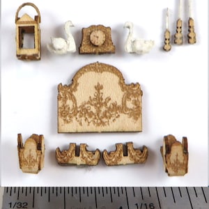May include: A set of wooden dollhouse furniture pieces, including a fireplace, a clock, a lantern, two swans, and two chairs. The pieces are all unfinished and ready to be painted or stained.