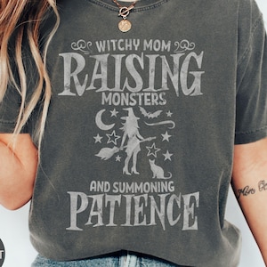 Witchy Mom Raising Monsters Tee, Funny Halloween Parenting Shirt, Fall Gift for Moms, Witchy Mama T-Shirt, Halloween Summerween Mom Top