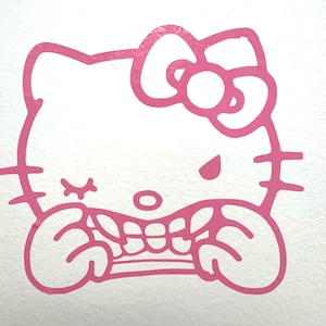 May include: Pink outline of a cartoon cat face with a large bow, winking eye, and a snarling expression. The cat's mouth is open, revealing teeth. The image is on a white background.