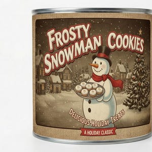 May include: A tin can featuring a vintage illustration for "Frosty Snowman Cookies." The image shows a snowman holding a tray of cookies, with a snowy village scene in the background. Text includes "Delicious Holiday Treats" and "A Holiday Classic."