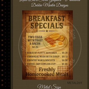 May include: A vintage-style metal sign with a brown burlap texture, advertising "Breakfast Specials." The sign features a graphic of eggs, toast, and bacon, with a menu listing various breakfast items and prices. The sign reads "Freshly Homecooked Meals."