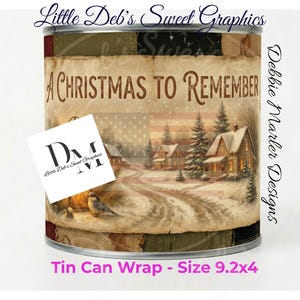 May include: A tin can wrap with a winter scene featuring houses, trees, and a snowy road. The words "A Christmas to Remember" are displayed on the front. The wrap is approximately 9.2 inches wide and 4 inches tall.