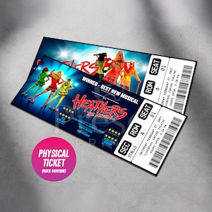 May include: Two theatre tickets for "Heathers the Musical" with a blue and red design. The tickets feature the show's title, cast names, and show details. A pink circle reads "Physical Ticket (Mock Souvenir)".