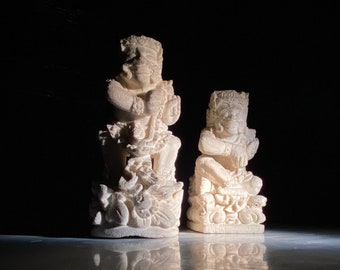 A Pair of Balinese Carved Limestone Demi-God Figures