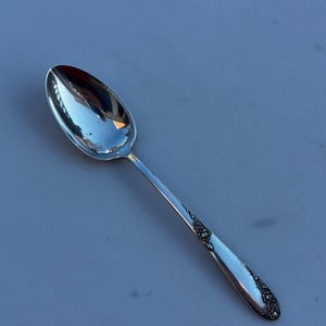 May include: A rustic wooden sign with the text "Welcome to our home" in white lettering. The sign features a distressed finish and a simple, inviting design, perfect for entryway decor.