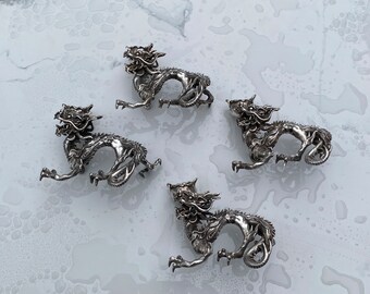 Four Solid Silver Dragon Candlesticks (2,264 grams)