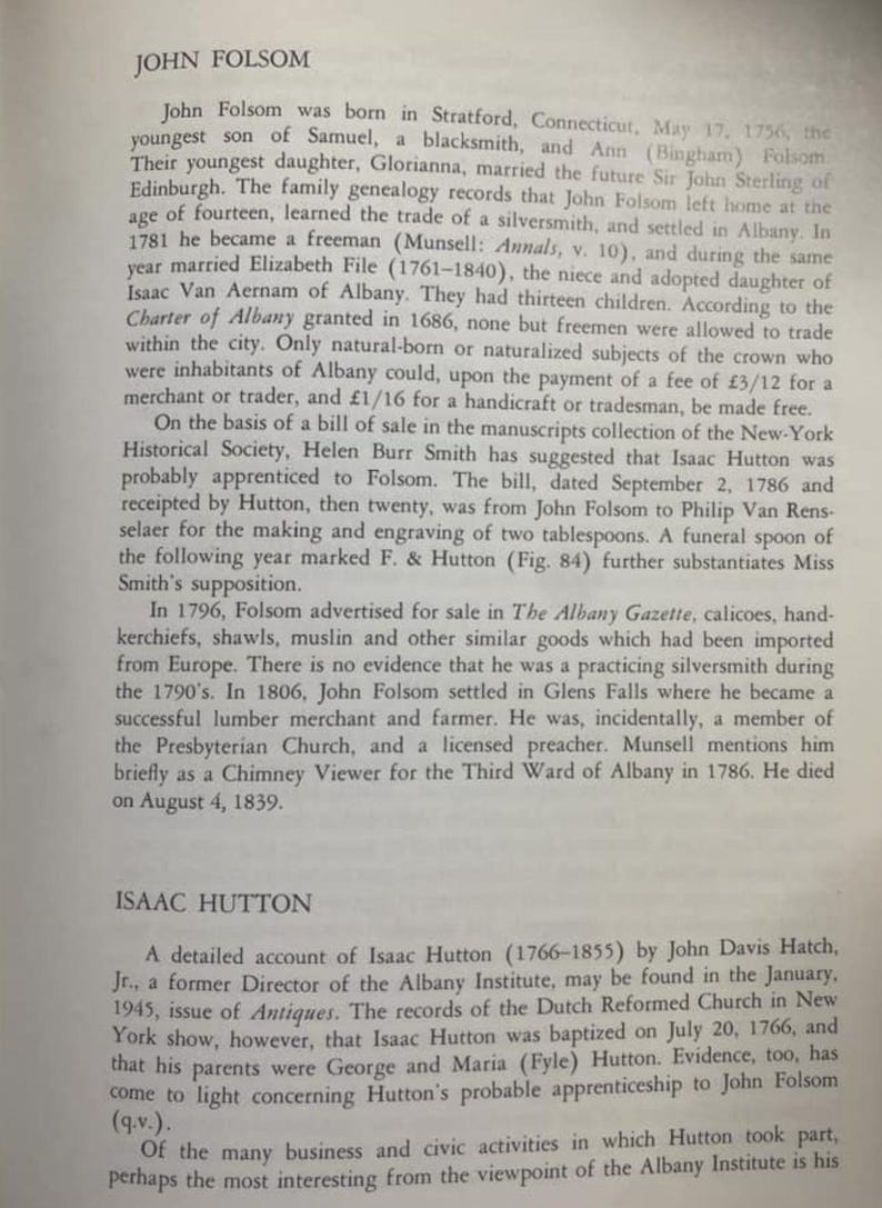 May include: A black and white text page from a book about the history of John Folsom and Isaac Hutton, two silversmiths from Albany, New York. The text describes their lives and careers, including their apprenticeships and the goods they sold.