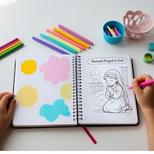 Child coloring the Hannah Prayed to God page at a desk with colored pencils and pastel paint swatches nearby.
