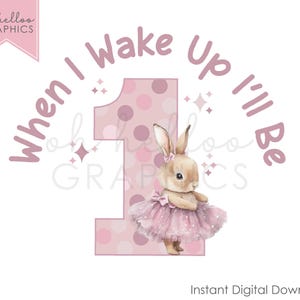 May include: Pink and white polka dot number one with a pink tutu wearing bunny in front of the text "When I Wake Up I'll Be".