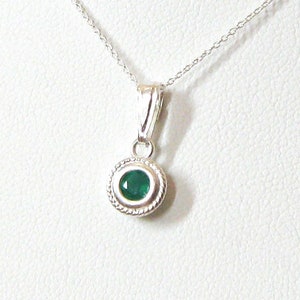 A faceted Green Onyx 4mm gemstone is set into a sterling silver solitaire pendant setting. The lovely emerald green color makes it a pretty substitute for emerald, the birthstone for May birthdays. Comes with a 16 or 18 inch 925 sterling chain.