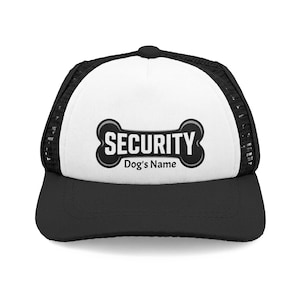 May include: A black and white trucker hat featuring a black mesh back and a solid white front panel. The front displays a black graphic of a dog bone with the word SECURITY in white capital letters and the text Dog's Name underneath.