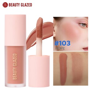 May include: A liquid blush product by Beauty Glazed. The blush is in a light pink tube with a matching cap. The applicator is visible, along with a swatch of the blush color. The text "#103 HOPE" is also visible.