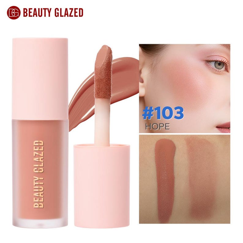 May include: A liquid blush product by Beauty Glazed. The blush is in a light pink tube with a matching cap. The applicator is visible, along with a swatch of the blush color. The text "#103 HOPE" is also visible.