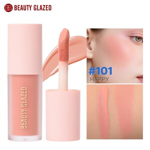 May include: A liquid blush product by Beauty Glazed. The product is in a clear bottle with a light pink cap and a peach-colored blush. The applicator is visible, along with a swatch of the blush. The text "#101 HAPPY" is also visible.