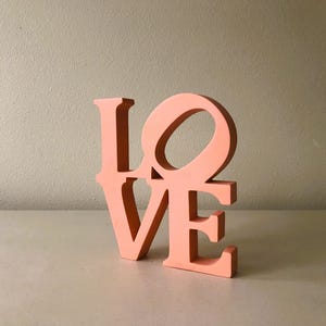 Contemporary LOVE Coral Peach Plastic Art Object Sculpture Figurine for Bookshelf, Table, or Mantel