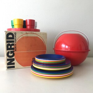 May include: A vintage Ingrid North Chicago serving set. The set includes a red ice bucket, colorful plates with rainbow trim, and a box with the Ingrid logo. The box holds colorful cups and a red tray.