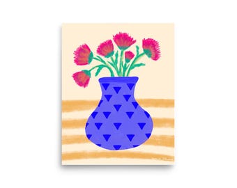 May include: A blue vase with a geometric pattern filled with pink flowers on a striped background.