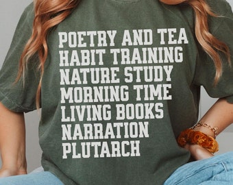 May include: A green t-shirt with white text that reads "Poetry and Tea, Habit Training, Nature Study, Morning Time, Living Books, Narration, Plutarch".